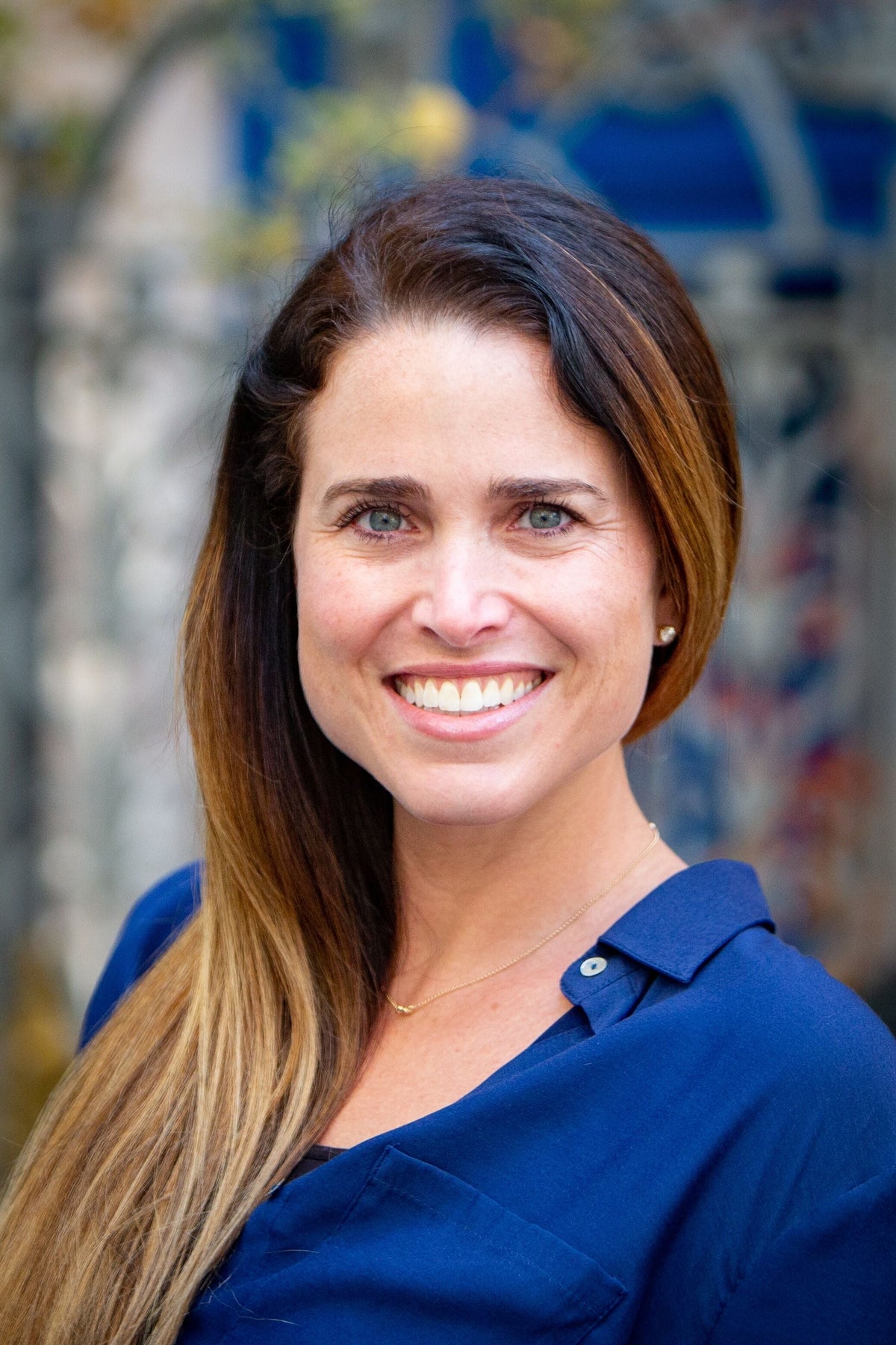 Portrait of Brooke Schnittman smiling in a blue shirt.