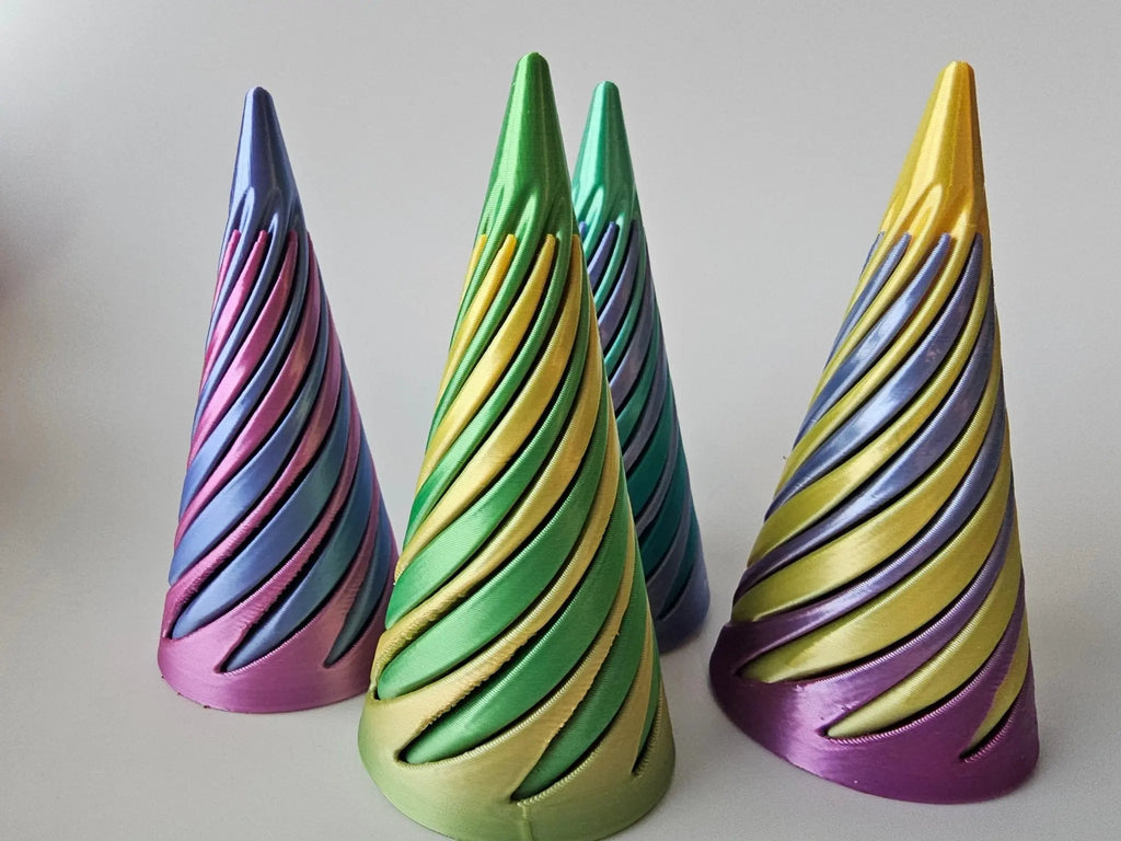Three twisted cone fidgets with multicolored striped finishes