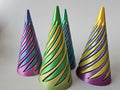 Three twisted cone fidgets with multicolored striped finishes