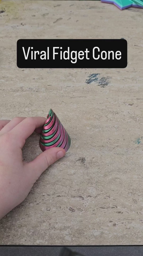 Supplier demonstration of the Swirl Cone Fidget twisting apart, rolling and spinning; colors vary.