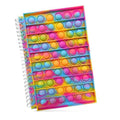 Spiral notebook with rows of rainbow-colored bubbles on its cover