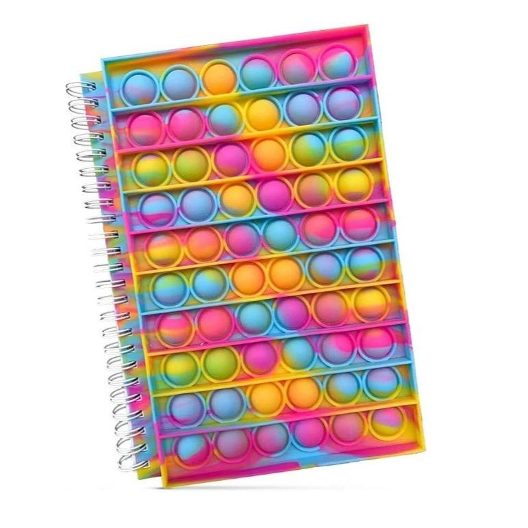 Spiral notebook with rows of rainbow-colored bubbles on its cover